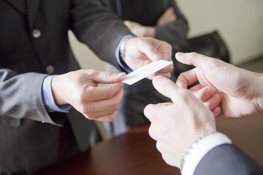  Men exchanging business cards